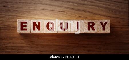 Enquiry word written on wooden blocks on wooden table Stock Photo