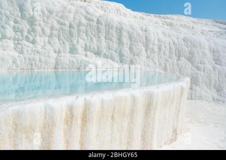 Beautiful white Travertine terrace with turquoise water in Pamukkale, Turkey. Stock Photo