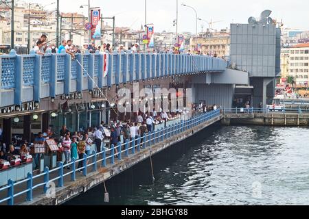 Istanbul, Turkey- September 21, 2017: View of the characteristic Galata bridge, with countless restaurants and fishermen Stock Photo