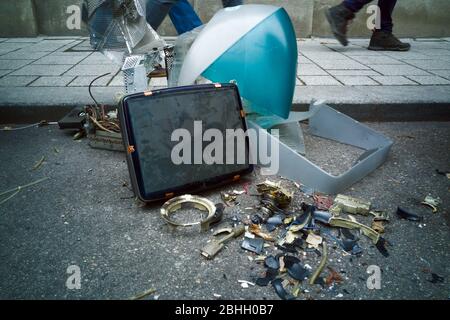 Broken outdated CRT Macintosh computer on the street Stock Photo