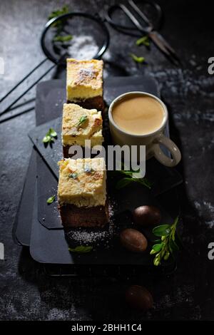 Cheesecake with coffee.Sweet dessert on the old table.Dark picture.Low fat drink and food. Stock Photo