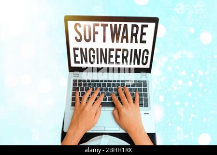 Writing note showing Software Engineering. Business concept for Program Development in Systematic Quantifiable approach Stock Photo