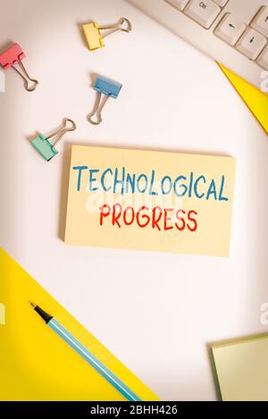 Conceptual hand writing showing Technological Progress. Concept meaning overall Process of Invention Innovation Diffusion Flat lay with pc keyboard an Stock Photo