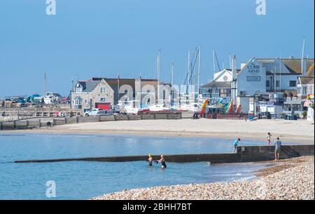Lyme Regis, Dorset, UK. 26th Apr, 2020. UK Weather: Warm and sunny at the seaside resort of Lyme Regis during the coronavirus pandemic lockdown. A few people are out and about taking their permitted daily exercise. The April heatwave is set to end this week. Credit: Celia McMahon/Alamy Live News Stock Photo