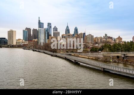 Cityscape of Philadelphia skyscraper Skylines building sunset with pedestrian walkway along river in Philly city downtown of Philadelphia in PA USA. C Stock Photo