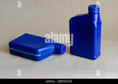 Two blue plastic canister for lubricants without label, container for chemicals.1 liter plastic containers. Close-up. Selective focus. Stock Photo