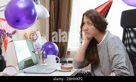 Woman celebrating birthday from home Stock Photo
