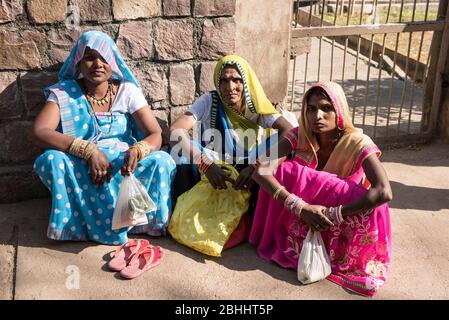 Khajuraho / India 25 February 2017 three Indian hindu Women  sitting on the ground at khajuraho madhya pradesh India Stock Photo