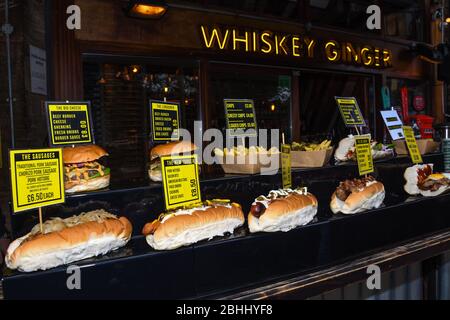 Sandwiches display during fast food festival outdoor event. Outside catering. Food Buffet Catering Dining Eating Party Sharing Concept. Meat, bacon, c Stock Photo