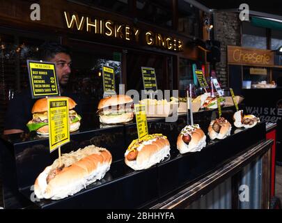 Sandwiches display during fast food festival outdoor event. Outside catering. Food Buffet Catering Dining Eating Party Sharing Concept. Meat, bacon, c Stock Photo