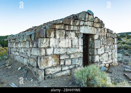 Ruin of a stone masonry building in the old silver and cinnabar mining ghost town of Ione, Nevada, USA [No property release; available for editorial l Stock Photo