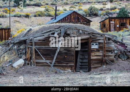 Wood shack with sod roof in the old silver and cinnabar mining ghost town of Ione, Nevada, USA [No property release; available for editorial licensing Stock Photo