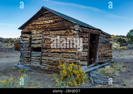 Old and abandoned log cabin in the old silver and cinnabar mining ghost town of Ione, Nevada, USA [No property release; available for editorial licens Stock Photo