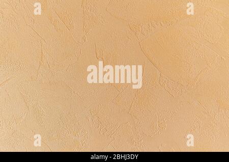 modern beige background, texture plaster patterns. yellowish tint Stock Photo