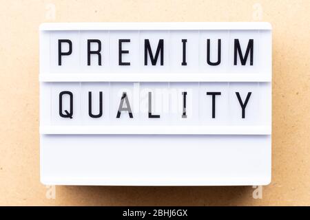 Lightbox with word premium quality on wood background Stock Photo