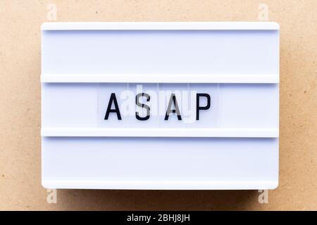 Lightbox with word ASAP (Abbreviation of as soon as possible) on wood background Stock Photo