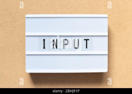 White lightbox with word input on wood background Stock Photo