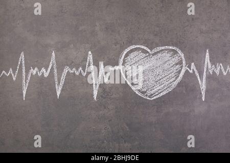 Heart drawn white chalk on a blackboard. Close up Stock Photo