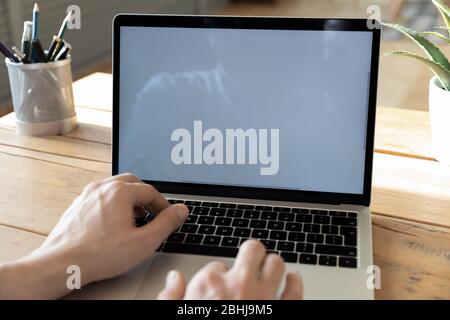 Close up businessman using laptop, white empty screen mock up Stock Photo