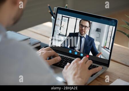 Close up businessman making video call, participating in online conference Stock Photo
