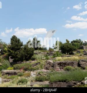 The Olympic Stadium seen from the Montreal Botanical Garden's Alpine Garden, Montreal, Quebec, Canada Stock Photo