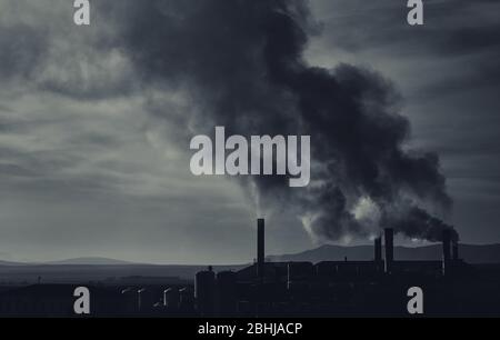 Power plant, smoke from the chimney. Air pollution environmental contamination, ecological disaster earth planet problems concept. Black and white ton Stock Photo