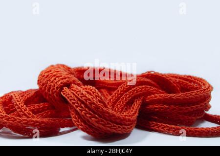 Orange spool knitted cord scarf isolated Stock Photo