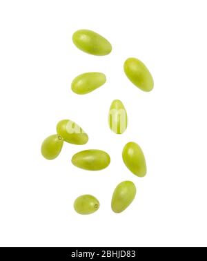 Falling green grapes isolated on white background with clipping path. Stock Photo
