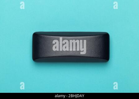 Black box of glasses or sunglasses isolated on blue background. Stock Photo