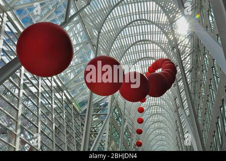 Toronto, Ontario, Canada - 06/12/2009:   A group of red balls is installed on the atrium of Brookfield Place. RedBall is a traveling public art piece Stock Photo