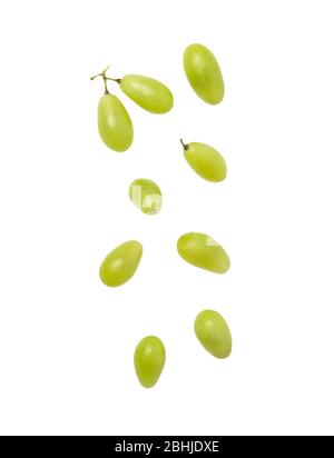 Falling green grapes isolated on white background with clipping path. Stock Photo