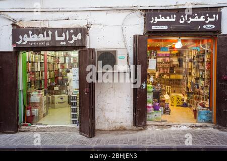 Jeddah / Saudi Arabia - January 16, 2020: Illuminated perfume stores in the street of the historic Al-Balad neighborhood Stock Photo