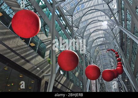 Toronto, Ontario, Canada - 06/12/2009:   A group of red balls is installed on the atrium of Brookfield Place. RedBall is a traveling public art piece Stock Photo