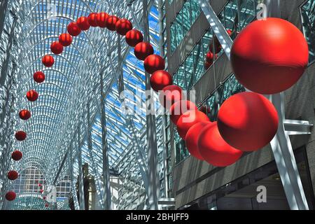 Toronto, Ontario, Canada - 06/12/2009:  A group of red balls is installed on the atrium of Brookfield Place. RedBall is a traveling public art piece Stock Photo