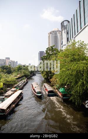 Bangkok, Thailand - February, 2020: View on canal near Pathumwananurak Park at Central World shopping mall in Siam district from Chaloem Loke Bridge Stock Photo