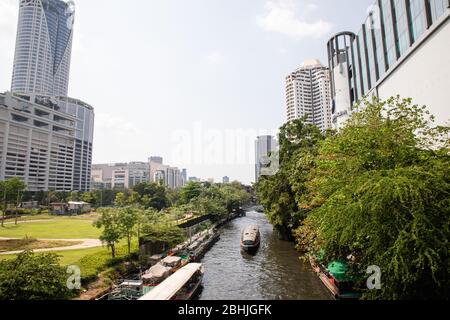 Bangkok, Thailand - February, 2020: View on canal near Pathumwananurak Park at Central World shopping mall in Siam district from Chaloem Loke Bridge Stock Photo