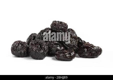 Pile of delicious prunes isolated on white background. Dried fruit Stock Photo