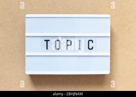 White lightbox with word topic on wood background Stock Photo