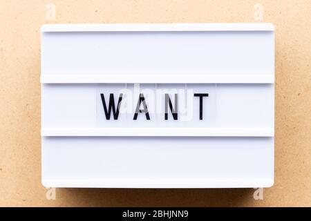 Lightbox with word want on wood background Stock Photo