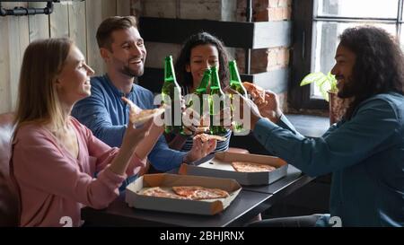 Happy multiracial friends have fun relaxing in cafe together Stock Photo