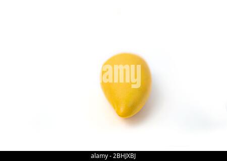 One whole mango fruit. Delicious ripe juicy fresh yellow mango isolated on white background. Exotic tropical fruits. Stock Photo