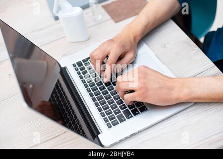 close up. modern man using a laptop. Stock Photo