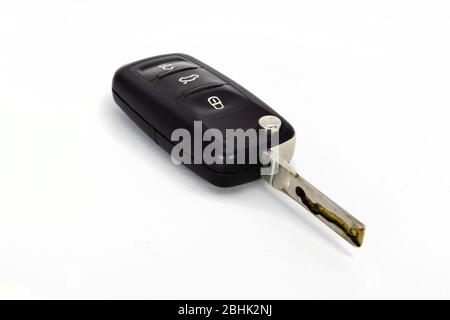 Isolated white background of black modern car key. Close up car key fob. Stock Photo