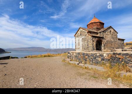 Sevan Monastery on the peninsula in Lake Sevan, Armenia and Holy Apostles Church (Surp Arakelot). Armenian Orthodox Apostolic Church near alpine lake. Stock Photo
