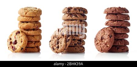Three different piles of fresh chocolate chip cookies isolated on white background Stock Photo