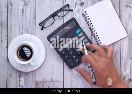 man hand using calculator on offie desk. Stock Photo