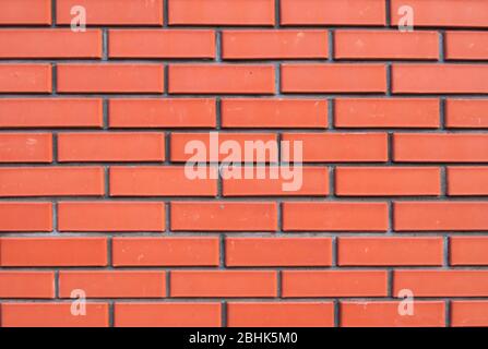 house wall made of red decorative flat brick, background Stock Photo