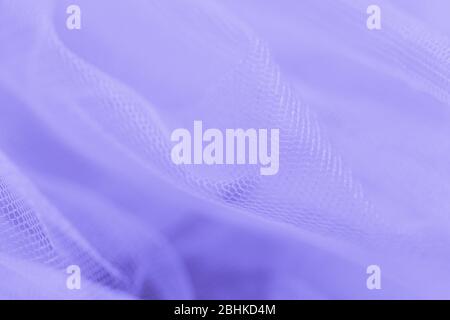 Light small mesh fabric on violet background. Shades of violet Stock Photo
