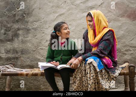 happy indian mother and daughter, mother helping her daughter in study Stock Photo