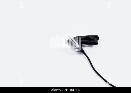Gray small clip-on microphone isolated Stock Photo